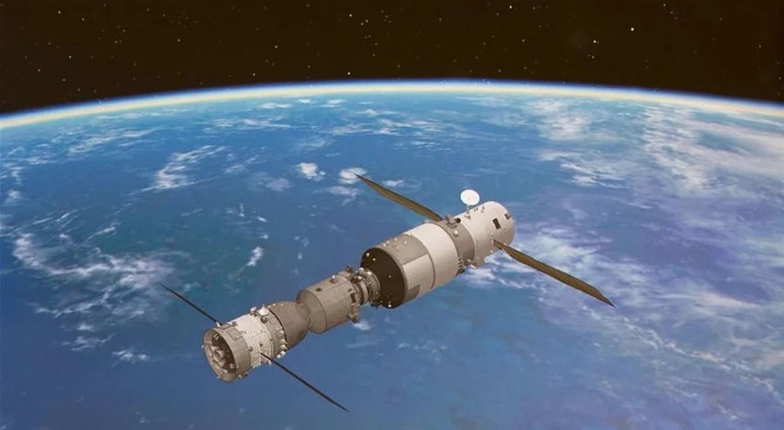A Chinese spacecraft with three astronauts docks at a new space station