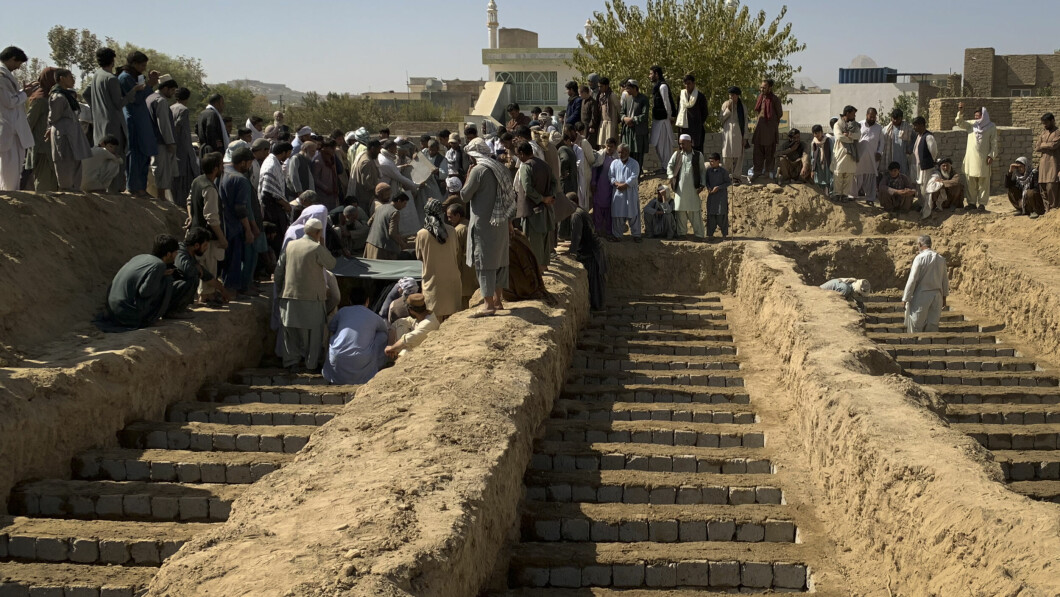 More dead: The burial of relatives of the victims after the suicide attack by ISIS on a mosque in Kandahar on Friday.  At least 47 people lost their lives.