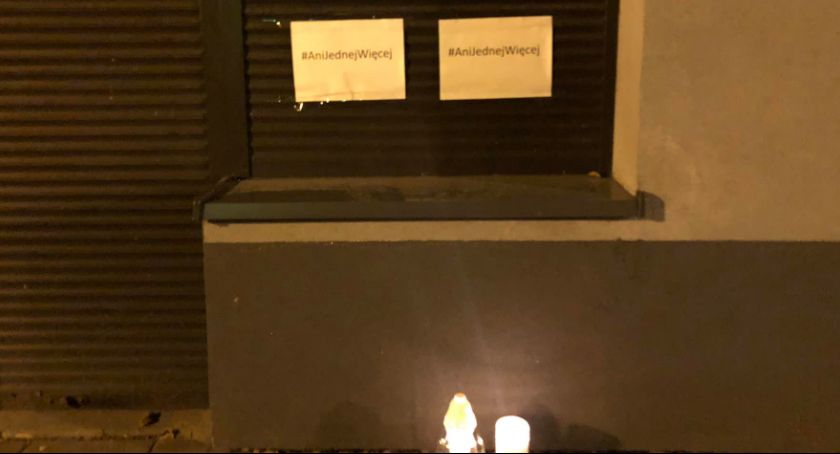 "Not One More": MP Milczanowska office front cards and candles.  Protest following the death of a 30-year-old girl in Radomsko