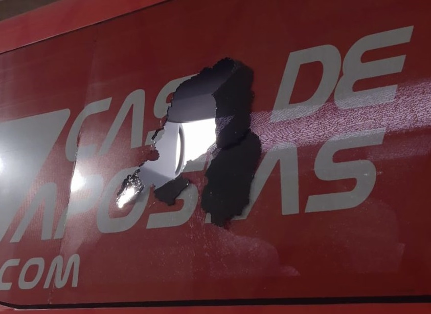 A bomb explodes inside the Bahia bus, injuring at least two players
