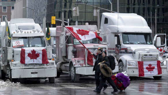 Progress: Demonstrations continued in Ottawa for about a week.  Here, protesters pass trucks parked downtown.  Photo taken on February 2, 2022. Photo: Adrian Wilde/The Canadian Press.