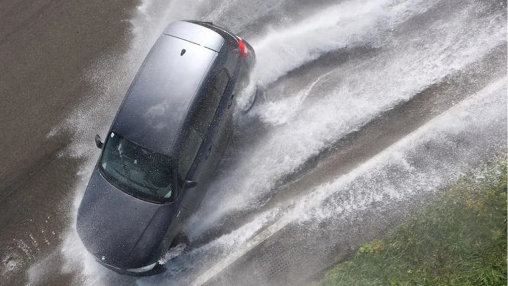 What do you do if your car gets into a "water sheet"?